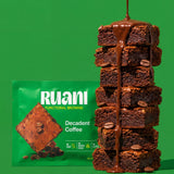 RUANI Decadent Coffee functional brownie stack with chocolate-espresso drizzle and coffee beans beside the product pack