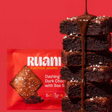 RUANI Dashing Dark Chocolate with Sea Salt functional brownie stack with chocolate drizzle and sea salt beside the product pack
