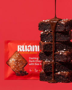 RUANI Dashing Dark Chocolate with Sea Salt functional brownie stack with chocolate drizzle and sea salt beside the product pack
