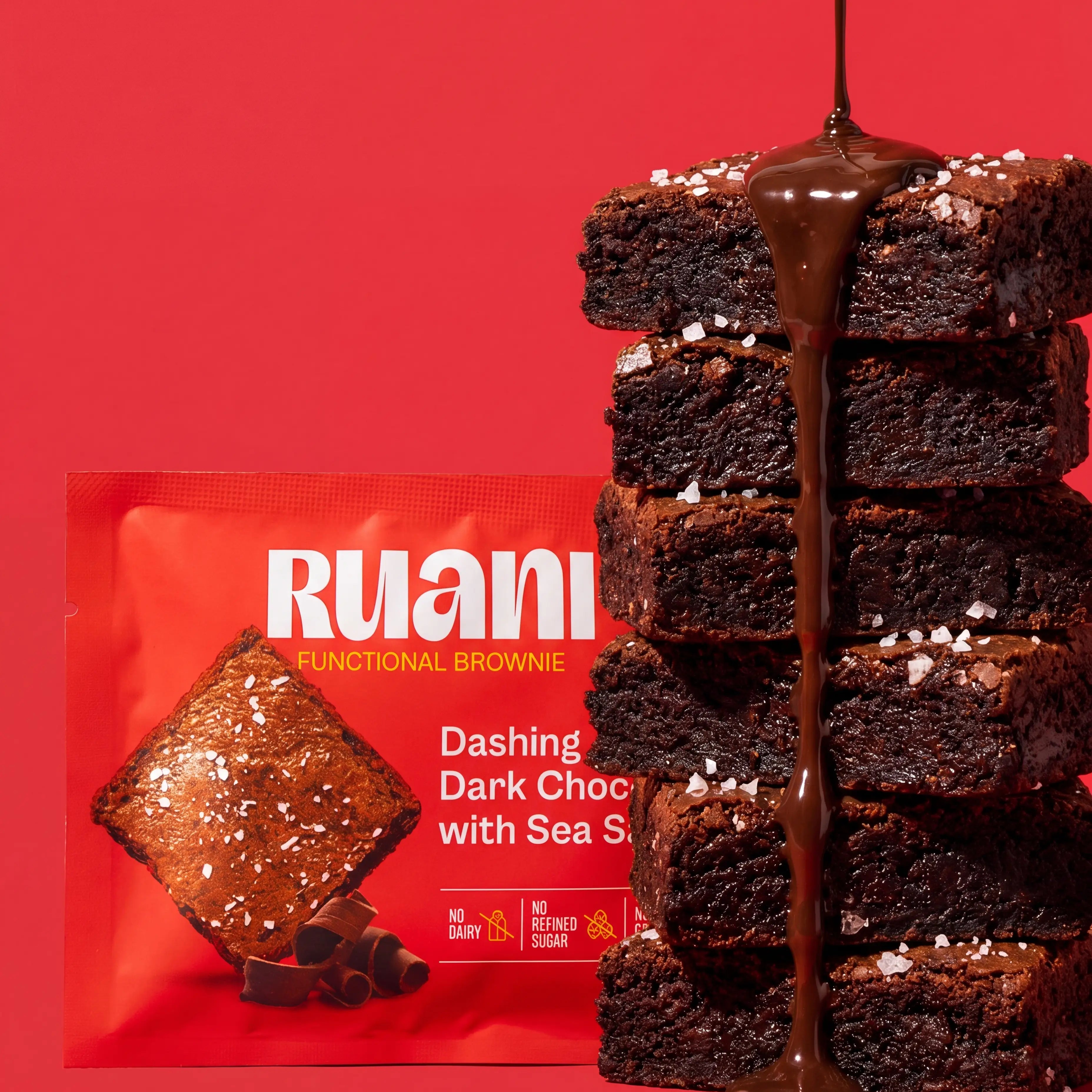 RUANI Dashing Dark Chocolate with Sea Salt functional brownie stack with chocolate drizzle and sea salt beside the product pack
