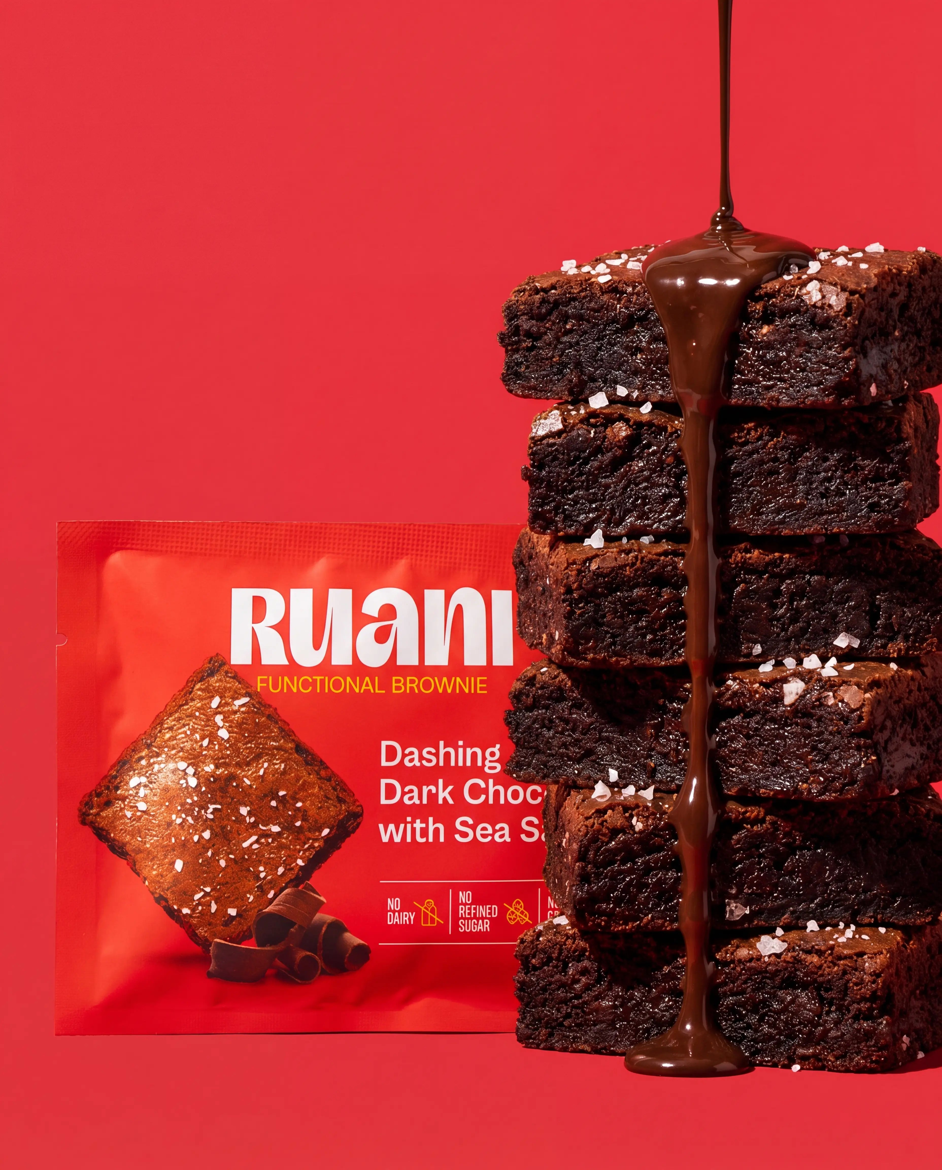 RUANI Dashing Dark Chocolate with Sea Salt functional brownie stack with chocolate drizzle and sea salt beside the product pack