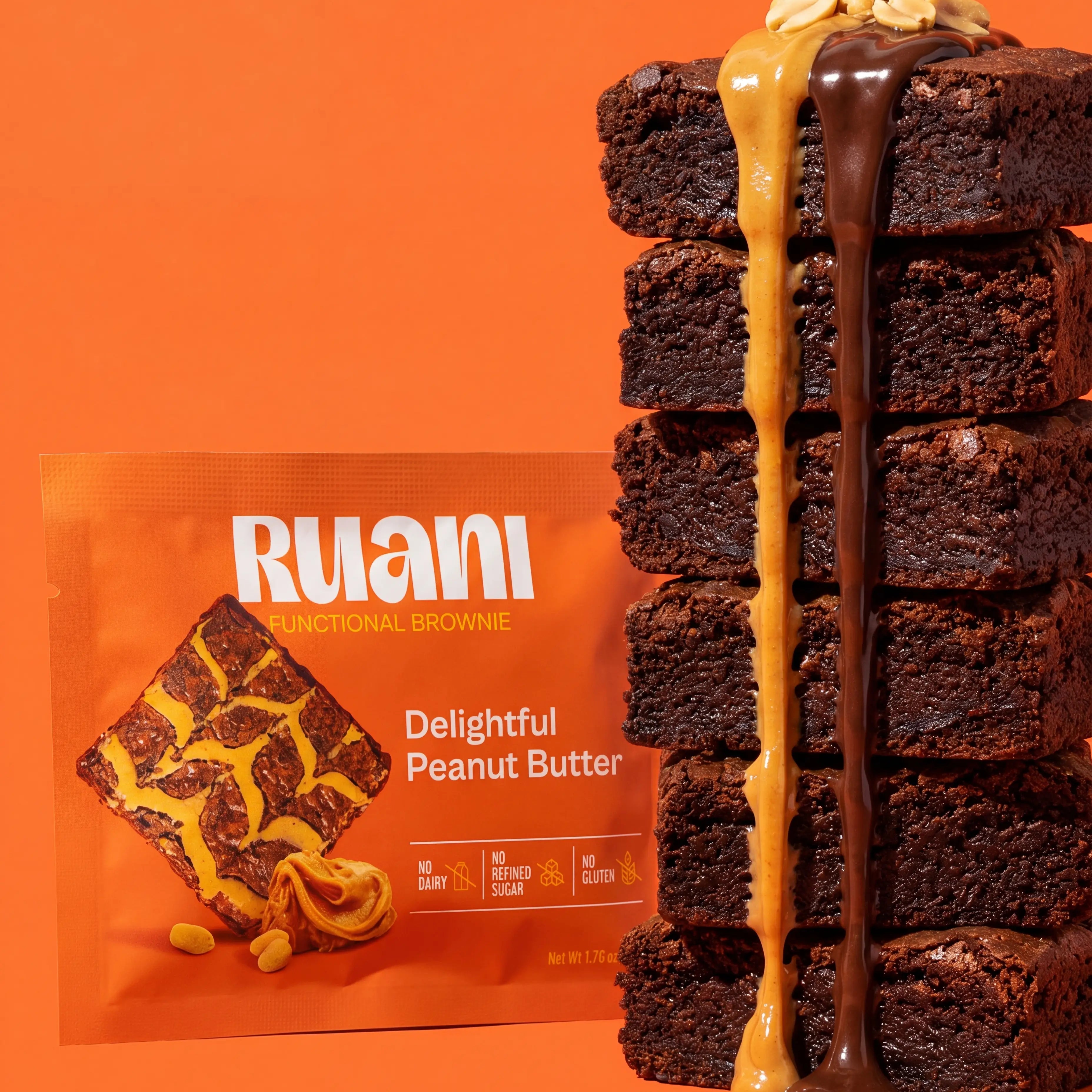 RUANI Delightful Peanut Butter functional brownie stack with peanut butter and chocolate drizzle beside the product pack