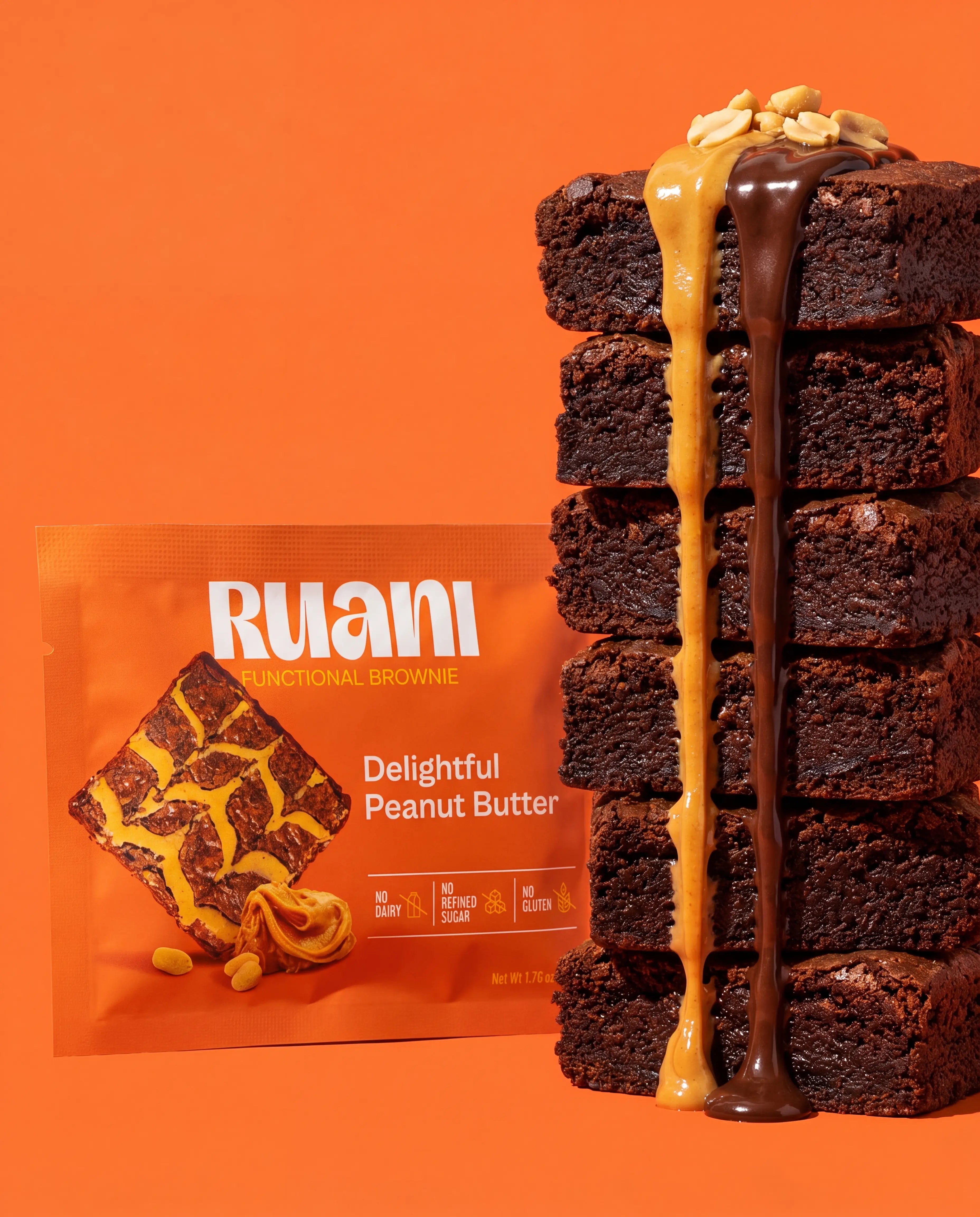 RUANI Delightful Peanut Butter functional brownie stack with peanut butter and chocolate drizzle beside the product pack