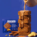 RUANI Delicious Chai Spiced Blondie stack with chai poured from a kettle beside the product pack