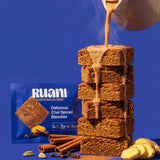 RUANI Delicious Chai Spiced Blondie stack with chai poured from a kettle beside the product pack
